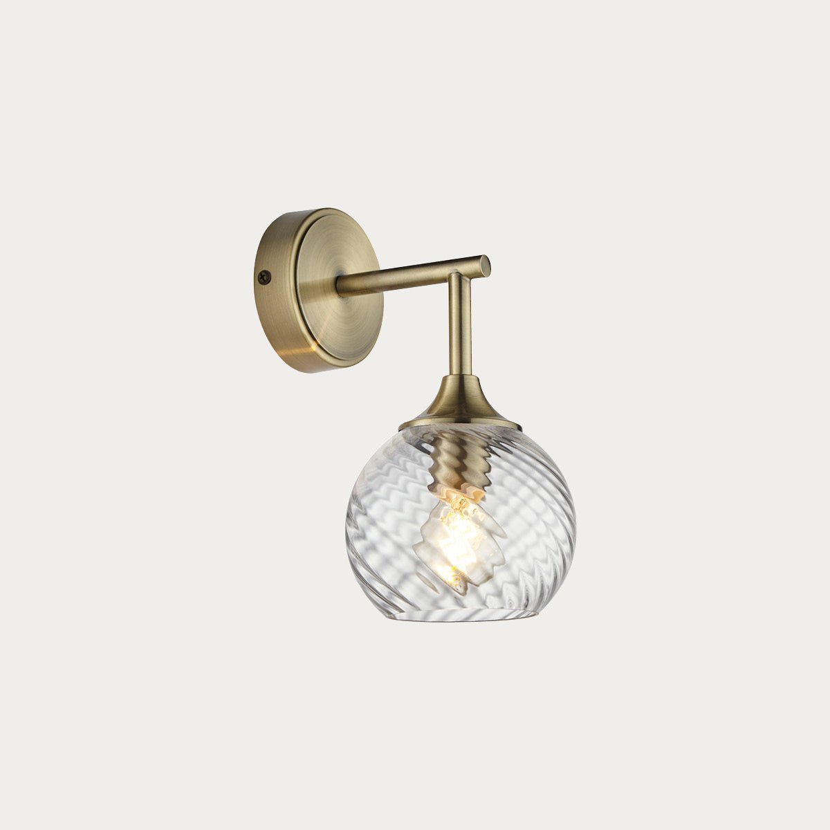 H2501PP0663_F0EEEB_8f9d6ba5-1cb4-4ec7-b8d5-0f5f32fd3602.jpg Madeline Spiral Glass Wall Light in Antique Brass - Image 1